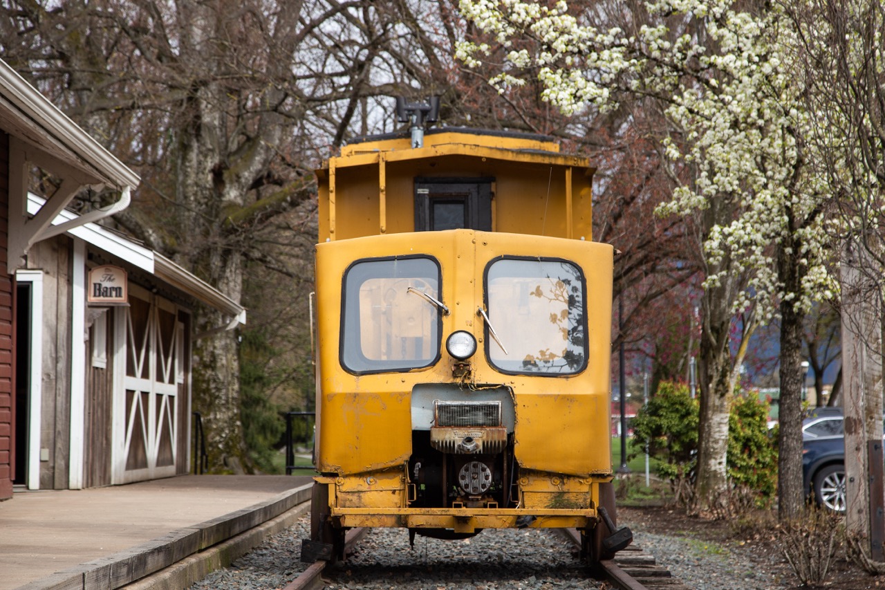 An old yellow train at a museum