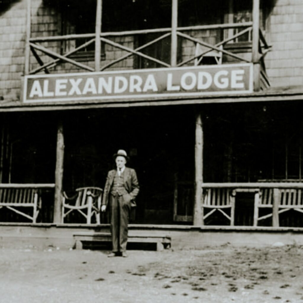 person in front of Alexandra Lodge