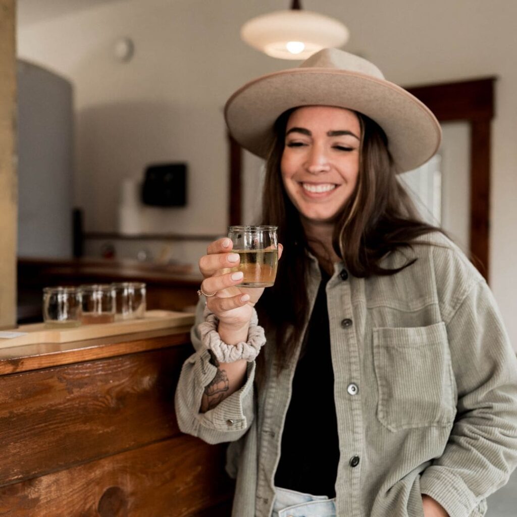 woman holding cider