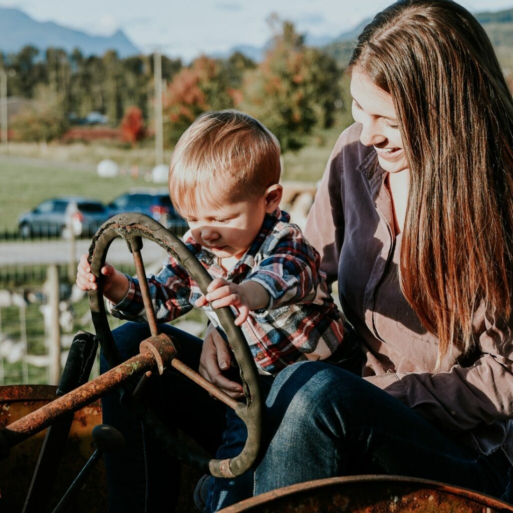 mom and child on tractor