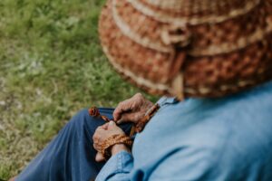 Woman weaving straw