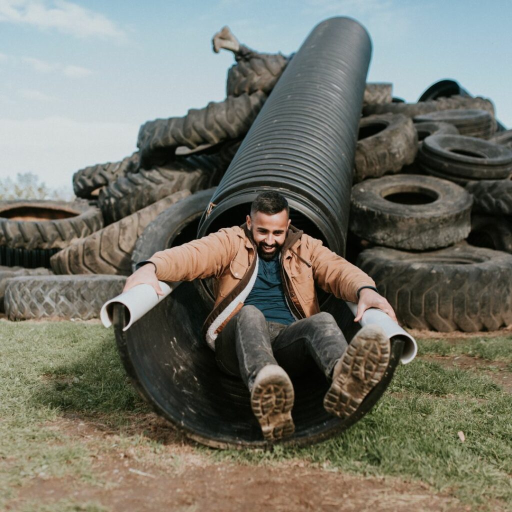 man on tire slide