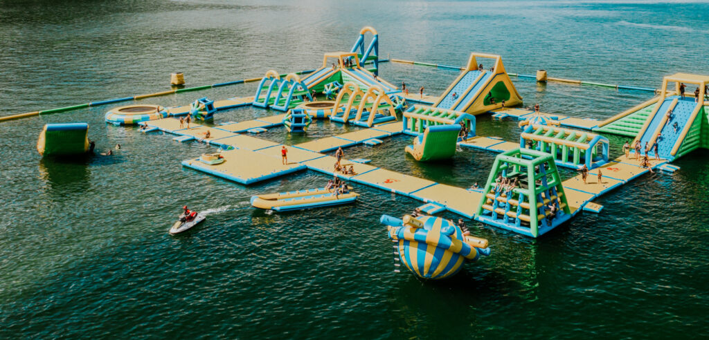 Harrison Aerial View Of Inflatable Waterpark On A Lake